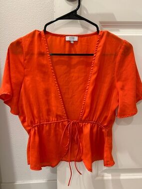 LAST CHANCE: Tobi V-Neck Tie-Front Peplum Blouse in Vibrant Orange